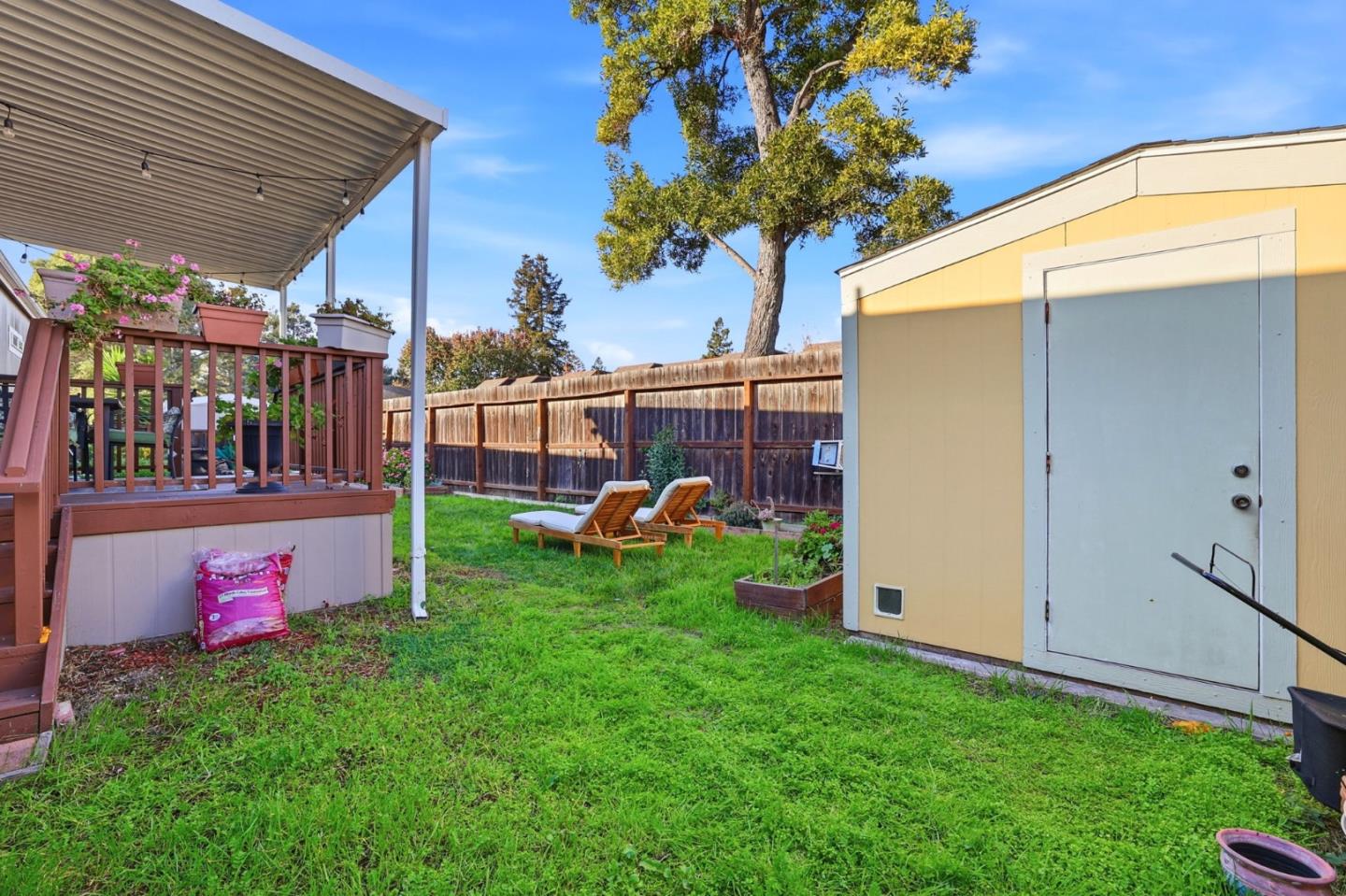 125 North Mary Avenue, Unit 17 Sunnyvale, CA 94086 - Photo 37 of 46 a view of a backyard with a table and chair