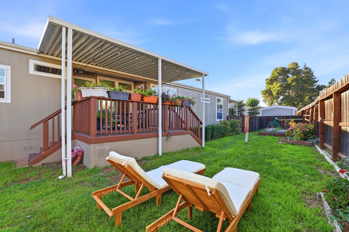 125 North Mary Avenue, Unit 17 Sunnyvale, CA 94086 - Photo 40 of 46 a view of backyard of house with wooden deck and outdoor seating