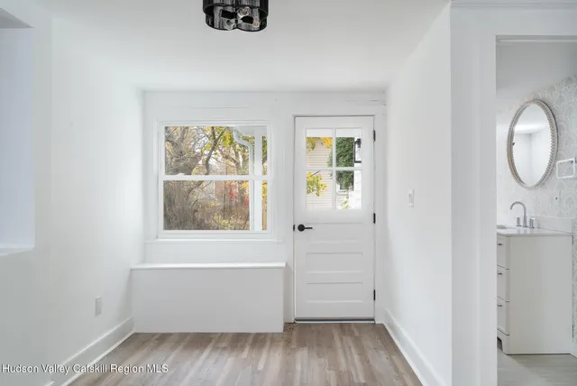 a view of room with window and hardwood floor