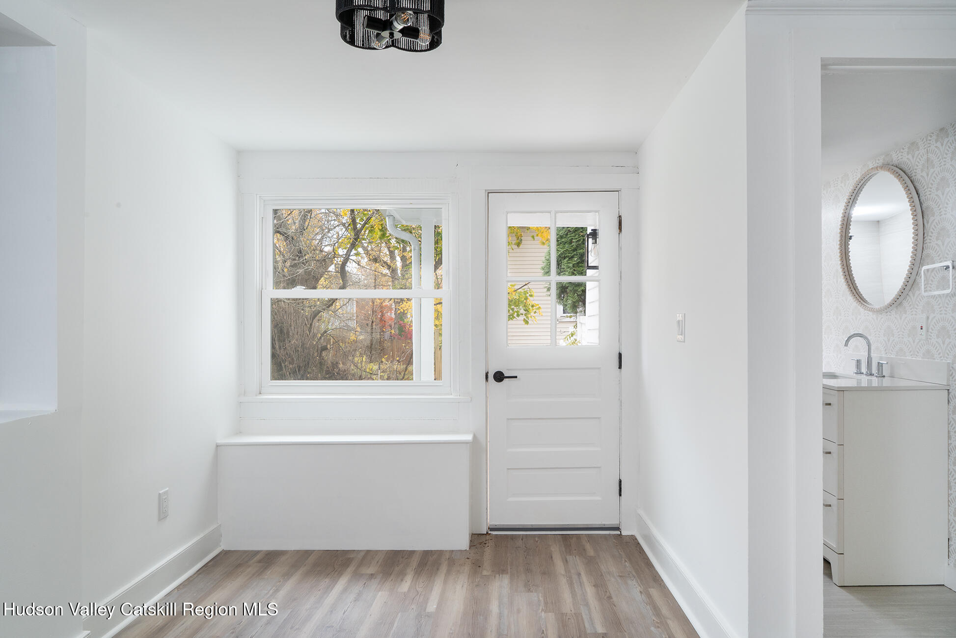 128 Broad Street Catskill, NY 12414 - Photo 6 of 15 a view of room with window and hardwood floor