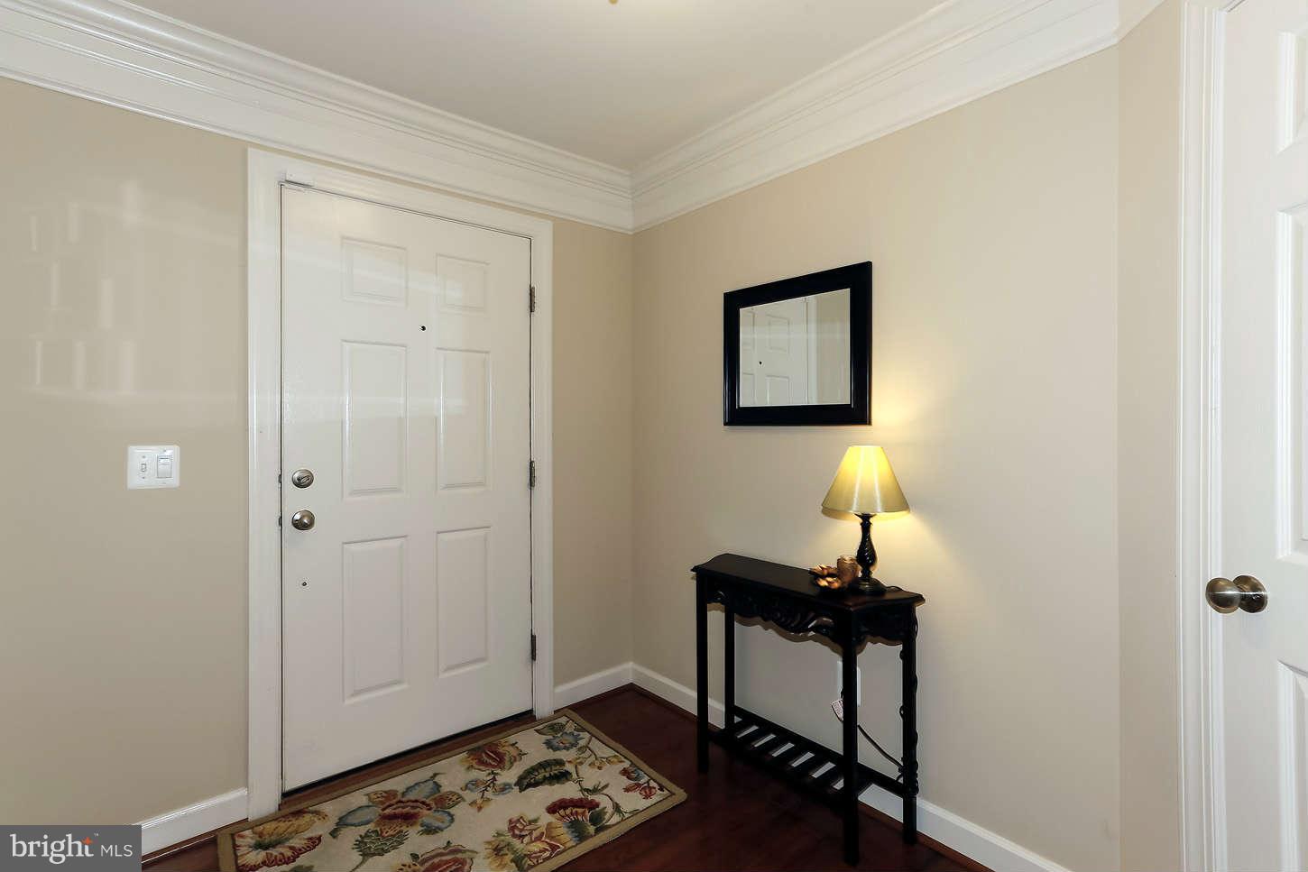 908 West Glebe Road Alexandria, VA 22305 - Photo 2 of 29 a room that has a table and a chair in it