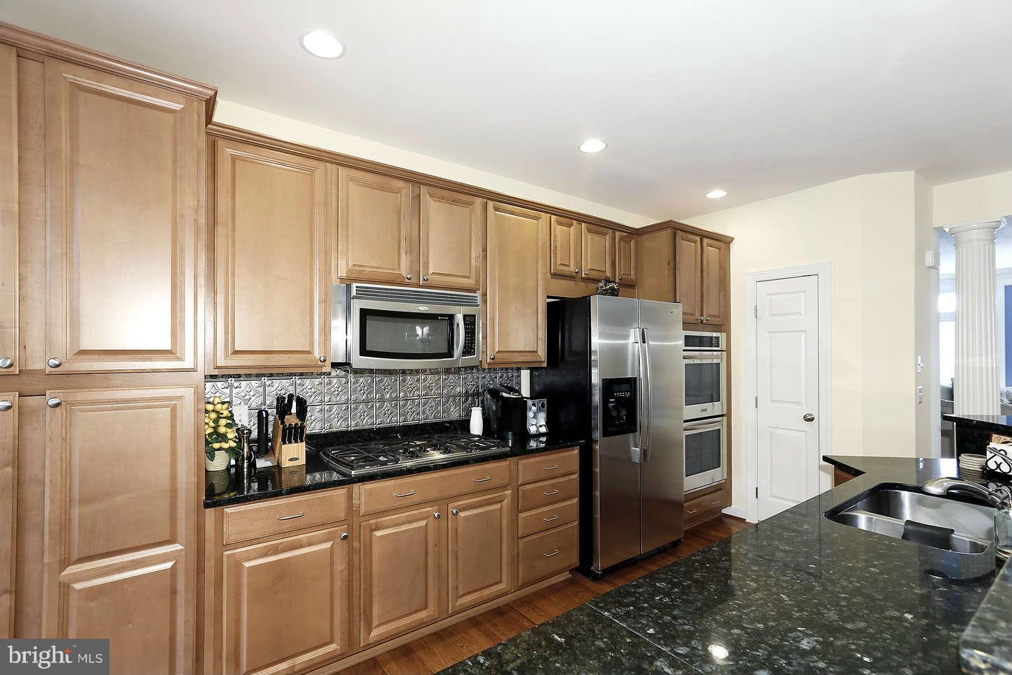 908 West Glebe Road Alexandria, VA 22305 - Photo 12 of 29 a kitchen with stainless steel appliances granite countertop a refrigerator and a stove top oven