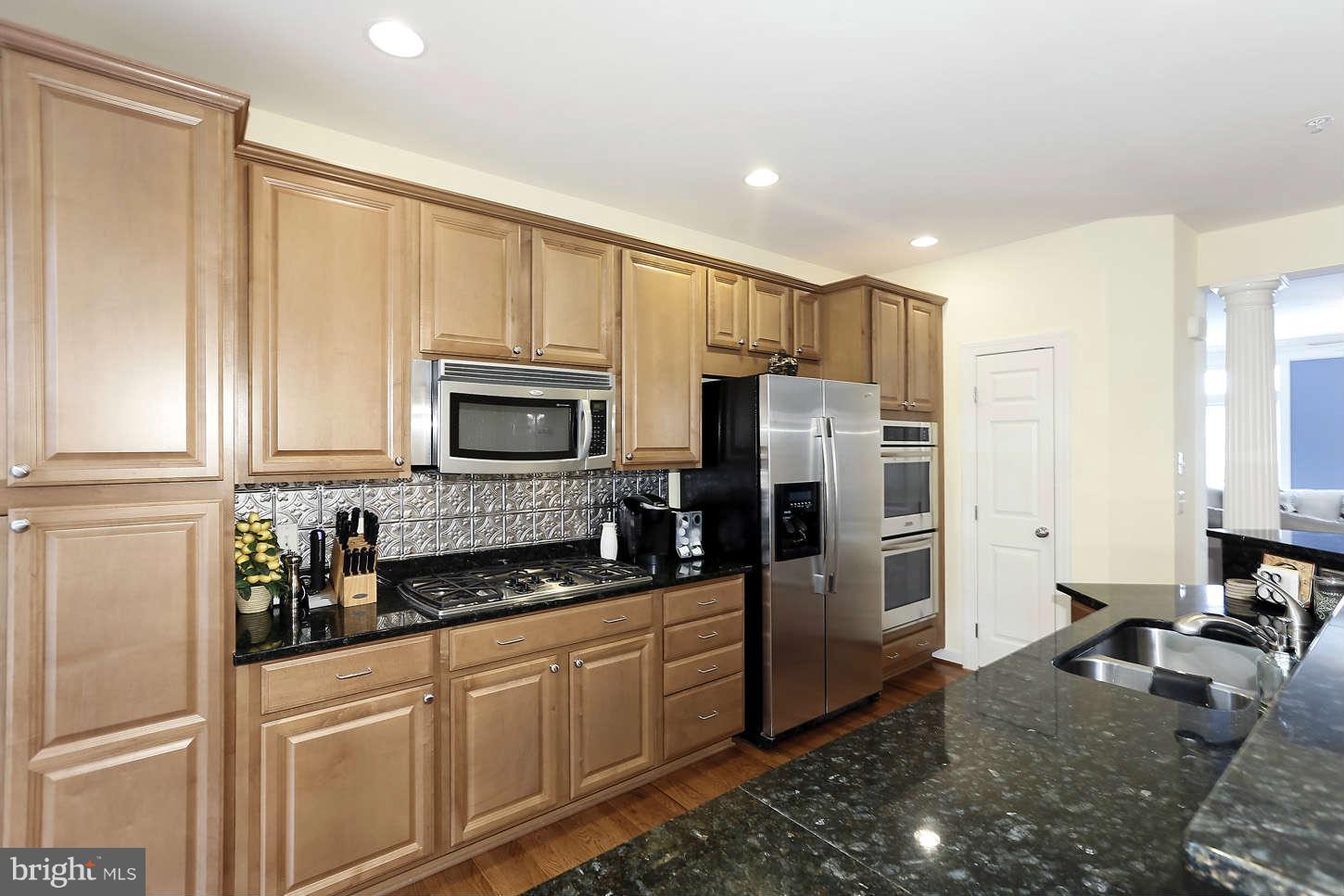 908 West Glebe Road Alexandria, VA 22305 - Photo 13 of 29 a kitchen with stainless steel appliances granite countertop a refrigerator stove and sink