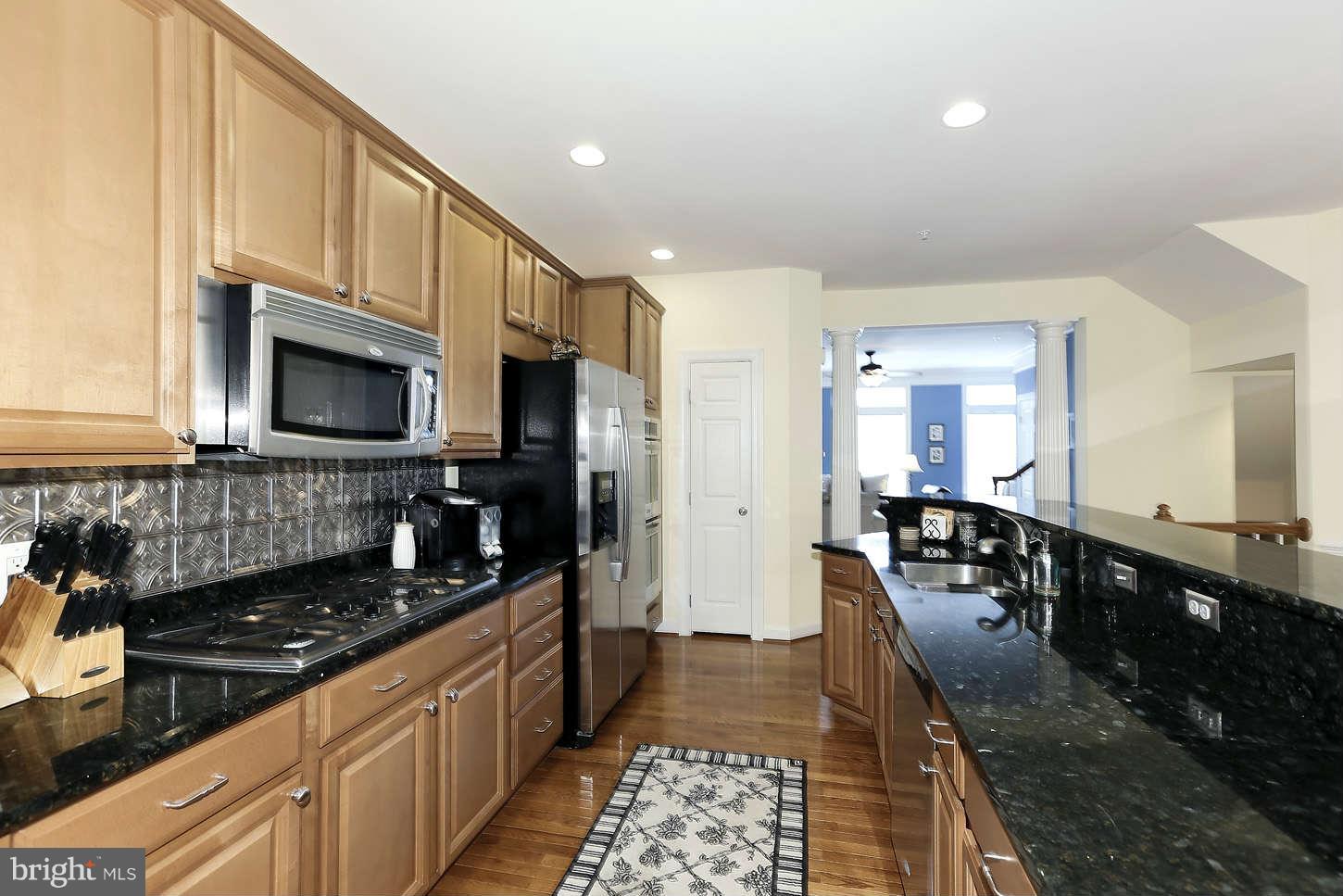 908 West Glebe Road Alexandria, VA 22305 - Photo 14 of 29 a kitchen with granite countertop a stove and cabinets
