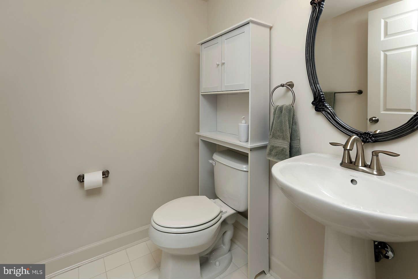 908 West Glebe Road Alexandria, VA 22305 - Photo 5 of 29 a bathroom with a sink a toilet and mirror