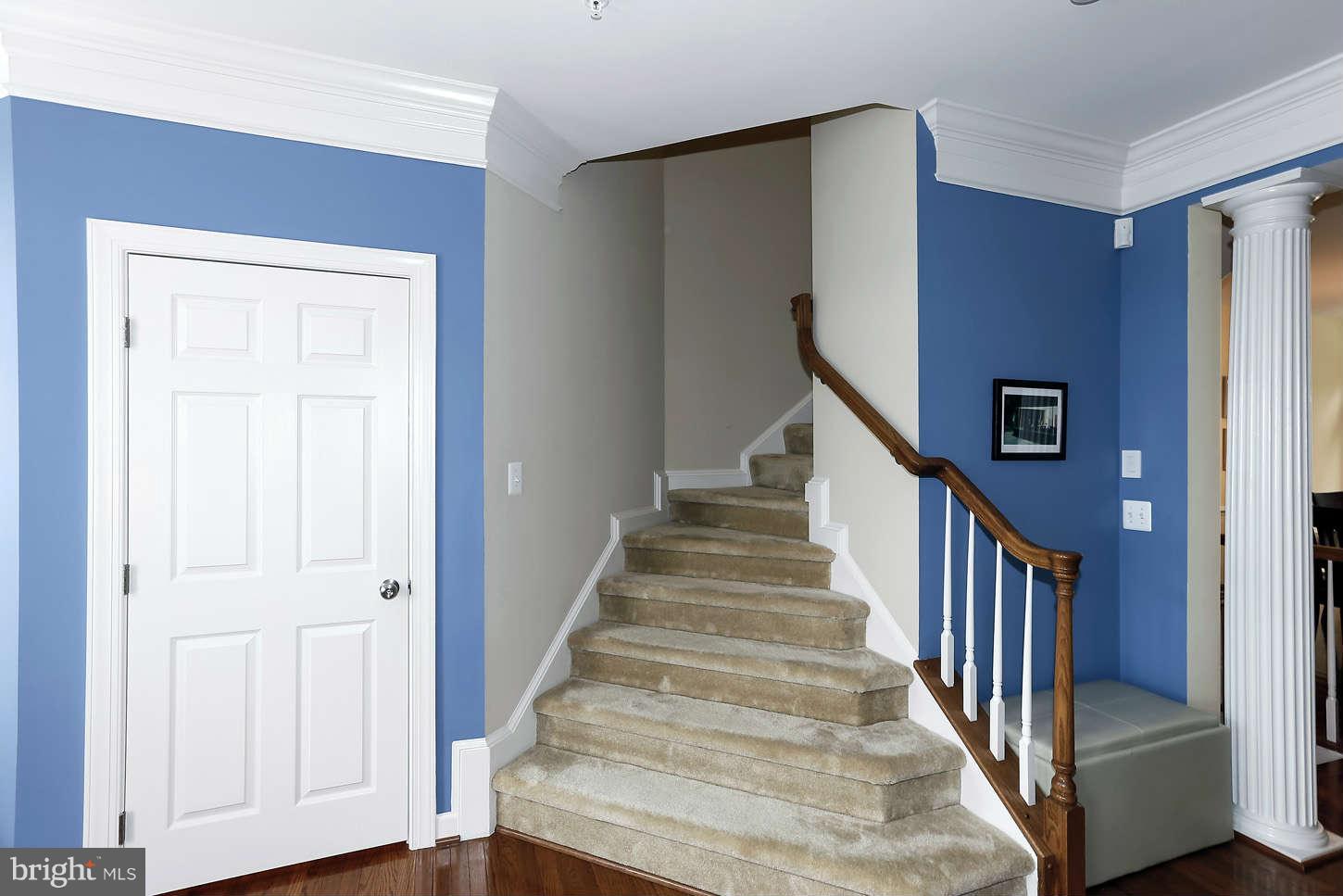 908 West Glebe Road Alexandria, VA 22305 - Photo 8 of 29 a view of entryway with wooden floor and stairs