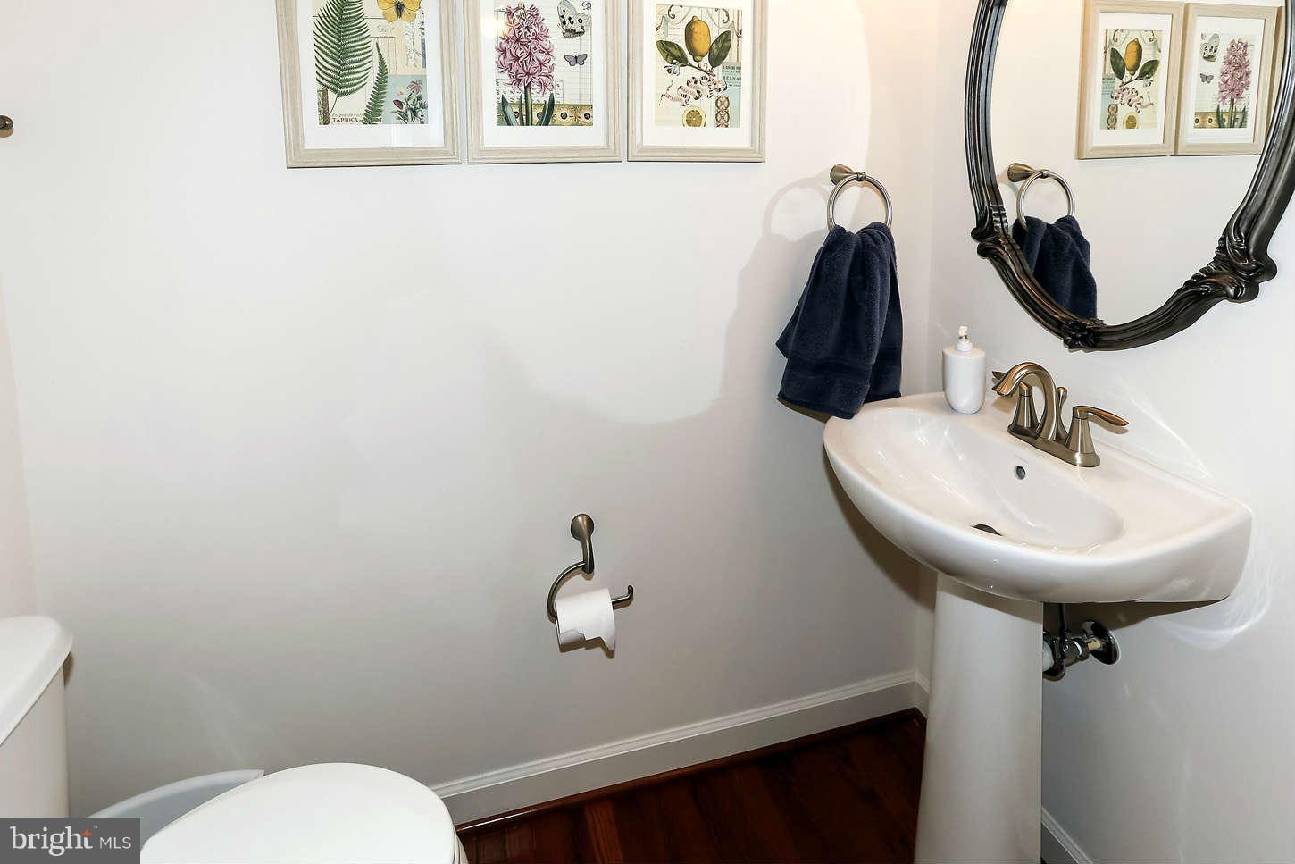 908 West Glebe Road Alexandria, VA 22305 - Photo 9 of 29 a bathroom with a toilet sink and mirror