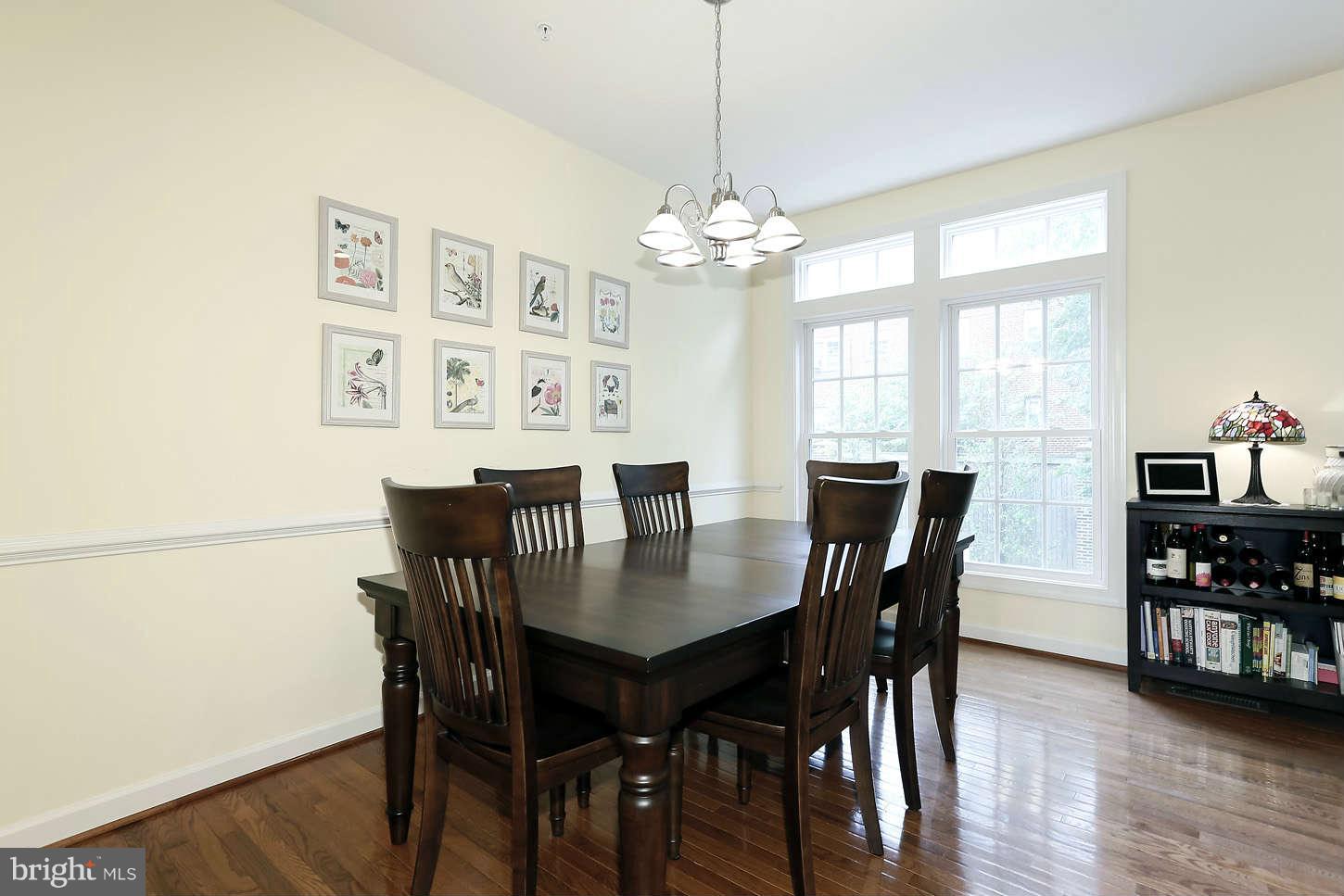 908 West Glebe Road Alexandria, VA 22305 - Photo 10 of 29 a view of a dining room with furniture window and wooden floor