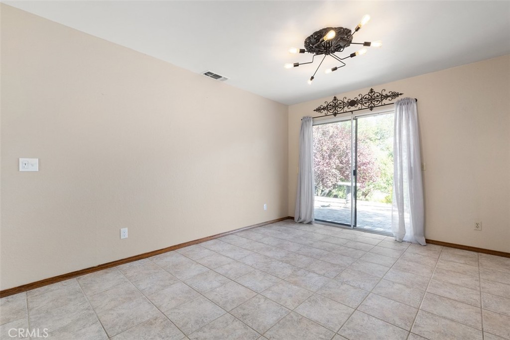 8070 Coromar Avenue Atascadero, CA 93422 - Photo 17 of 49 a view of an empty room with a window