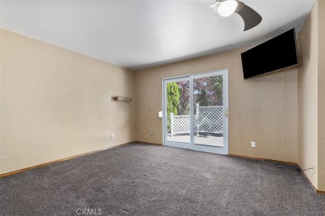 a view of an empty room with a flat screen tv