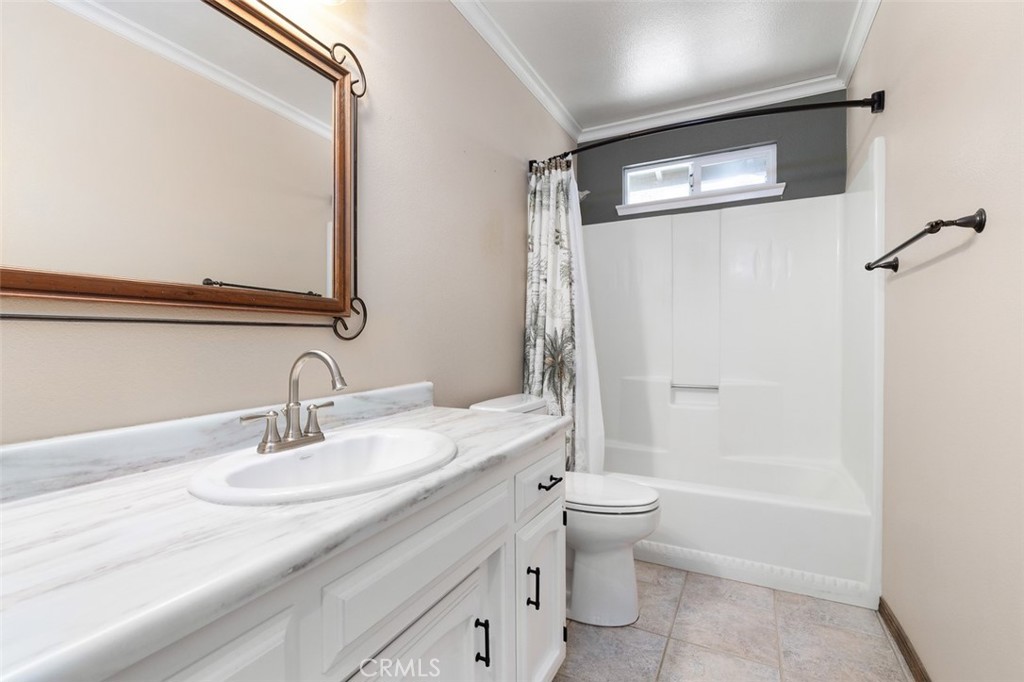 8070 Coromar Avenue Atascadero, CA 93422 - Photo 22 of 49 a bathroom with a granite countertop sink toilet and shower