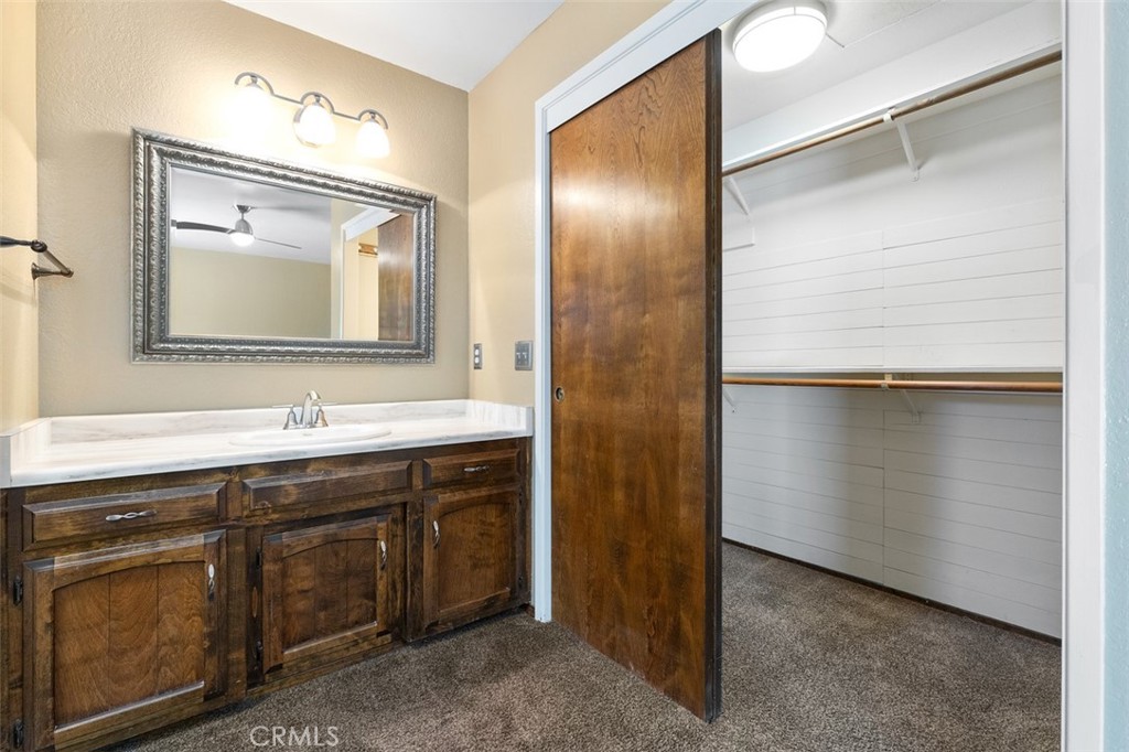 8070 Coromar Avenue Atascadero, CA 93422 - Photo 25 of 49 a bathroom with a sink and a mirror