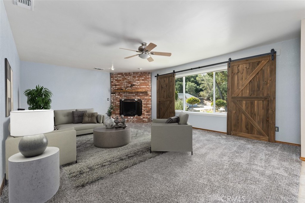 8070 Coromar Avenue Atascadero, CA 93422 - Photo 4 of 49 a living room with furniture and a fireplace