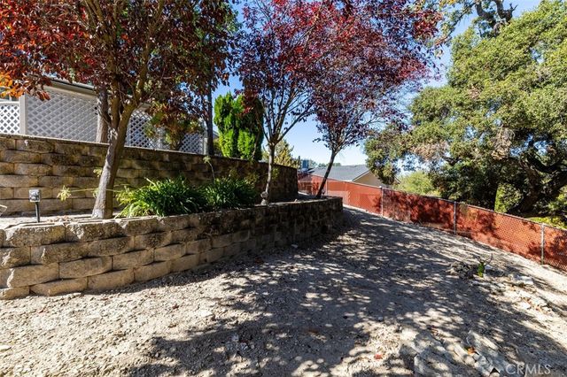 a view of a backyard of the house