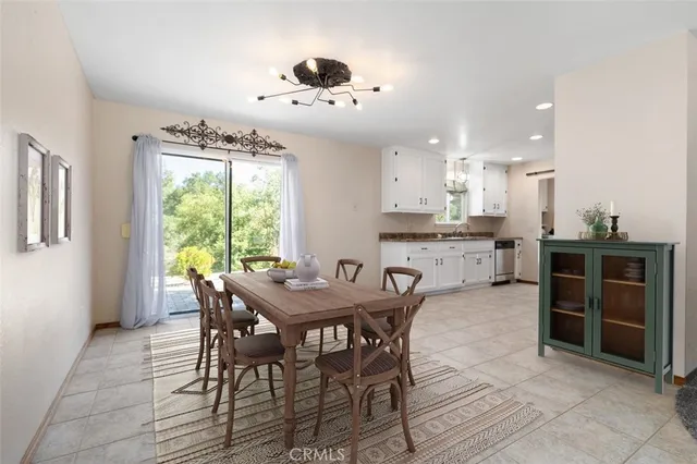 a view of a dining room with furniture and window