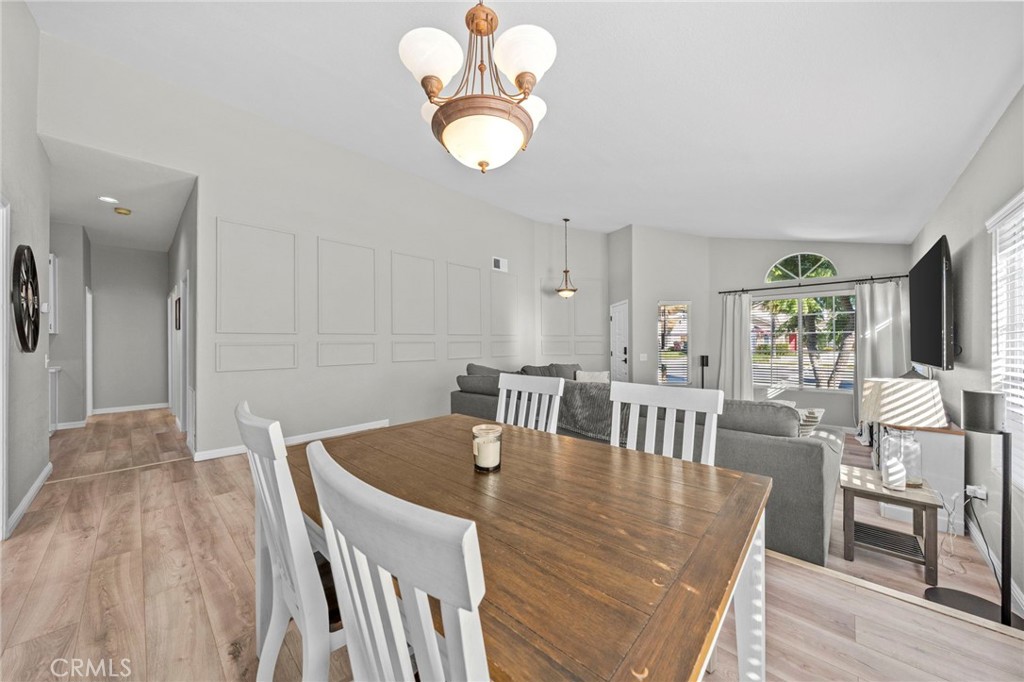 24529 Ridgewood Road Murrieta, CA 92562 - Photo 12 of 43 a view of a dining room with furniture and wooden floor
