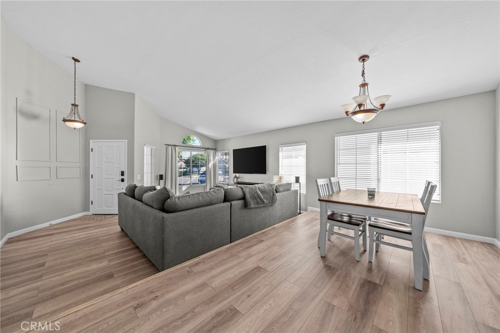 24529 Ridgewood Road Murrieta, CA 92562 - Photo 13 of 43 a living room with furniture a dining table and a wooden floor