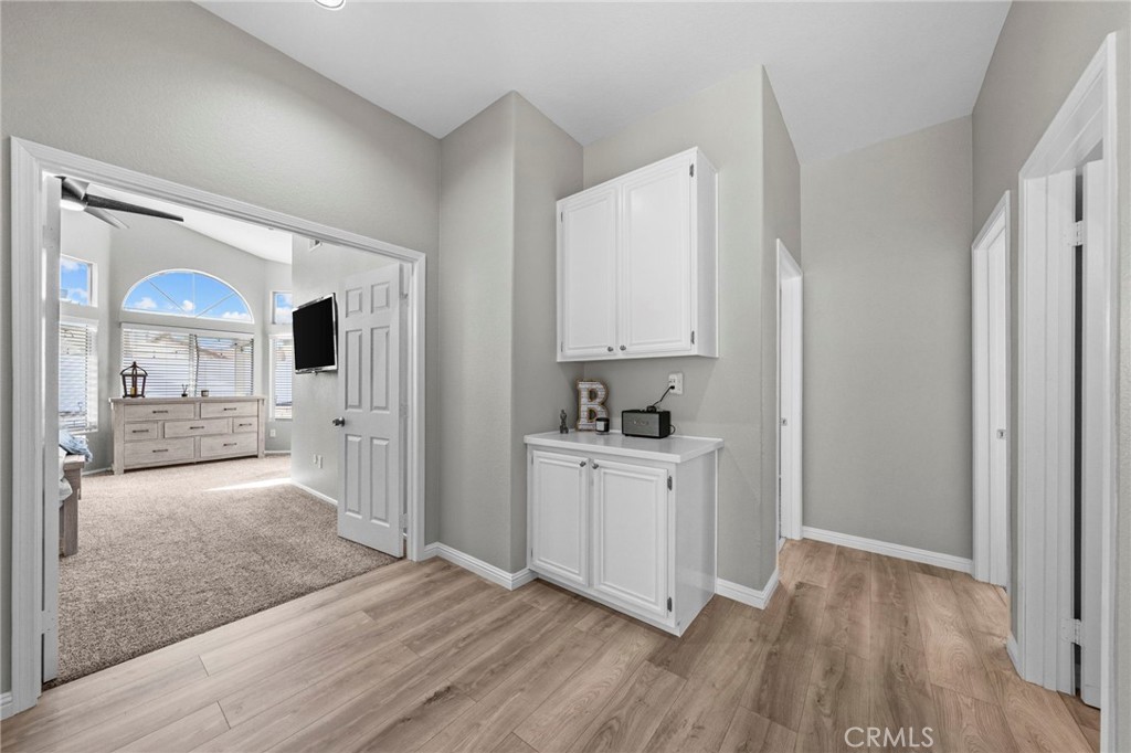 24529 Ridgewood Road Murrieta, CA 92562 - Photo 24 of 43 a view of a kitchen with wooden floor and a sink