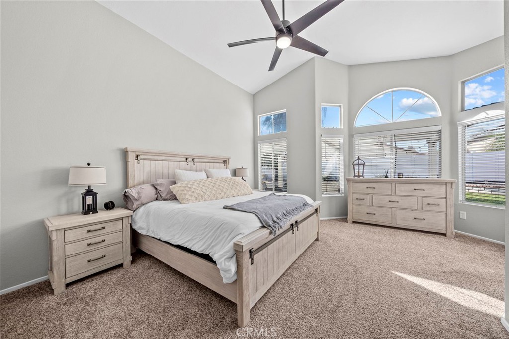 24529 Ridgewood Road Murrieta, CA 92562 - Photo 25 of 43 a spacious bedroom with a bed and a dresser