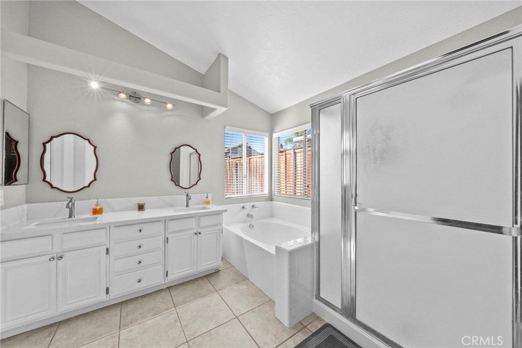 24529 Ridgewood Road Murrieta, CA 92562 - Photo 28 of 43 a bathroom with double vanity sink and a mirror