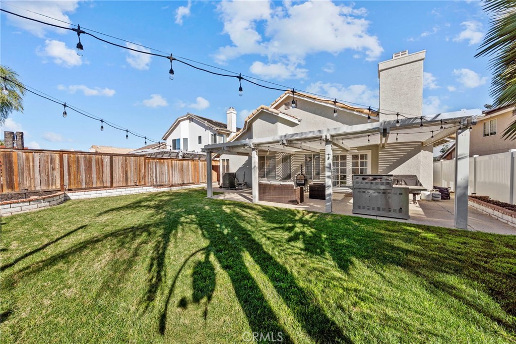 24529 Ridgewood Road Murrieta, CA 92562 - Photo 34 of 43 a view of a house with a backyard
