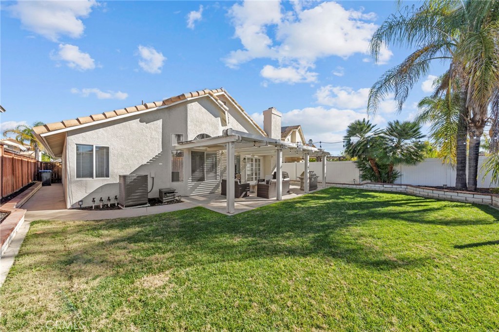 24529 Ridgewood Road Murrieta, CA 92562 - Photo 36 of 43 a view of a house with a big yard and potted plants