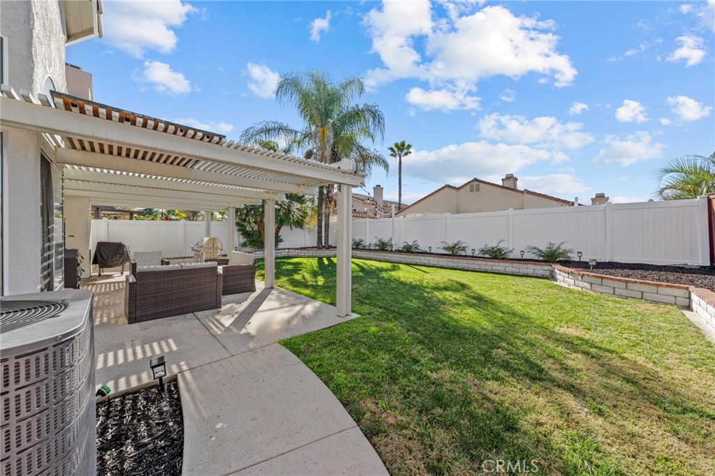 24529 Ridgewood Road Murrieta, CA 92562 - Photo 37 of 43 a view of a terrace with couches and wooden fence