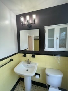 113 Rockland Street, Unit 2 Canton, MA 02021 - Photo 13 of 22 a bathroom with a toilet sink and mirror