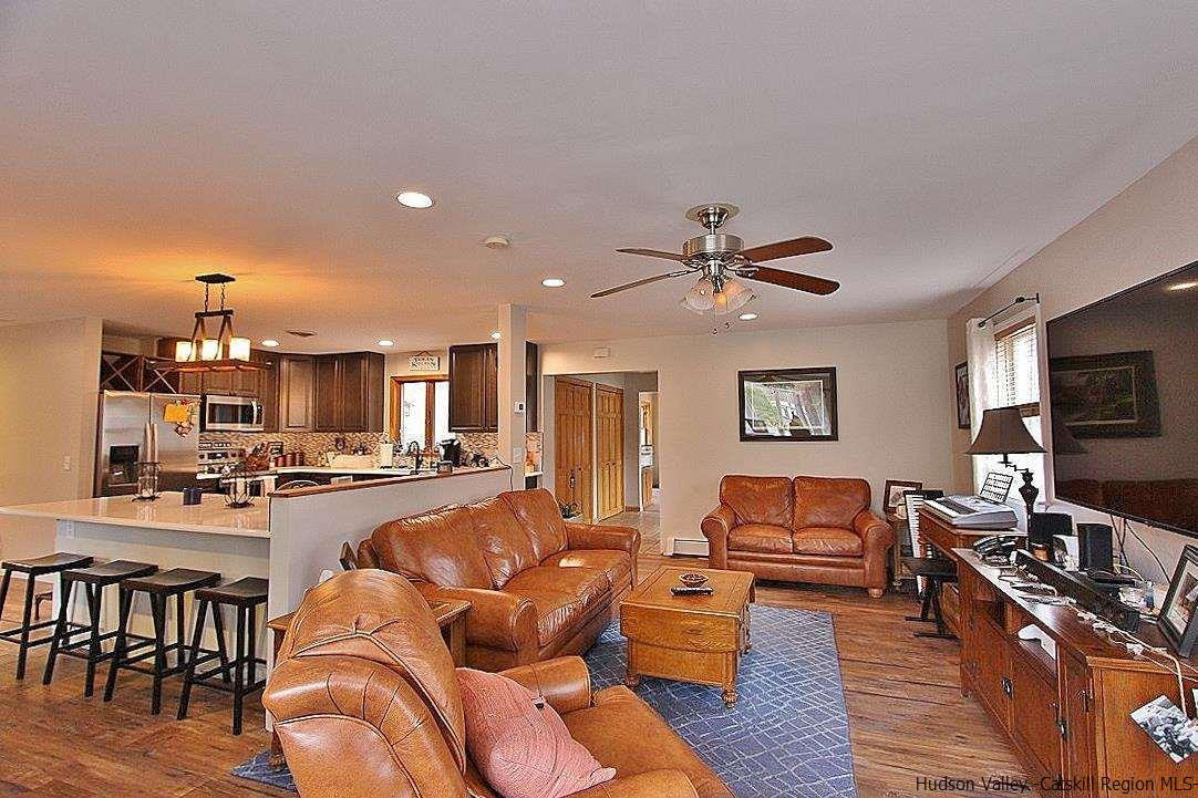 150 Nelson Hoff Road Saugerties, NY 12477 - Photo 12 of 31 a living room with furniture and a flat screen tv