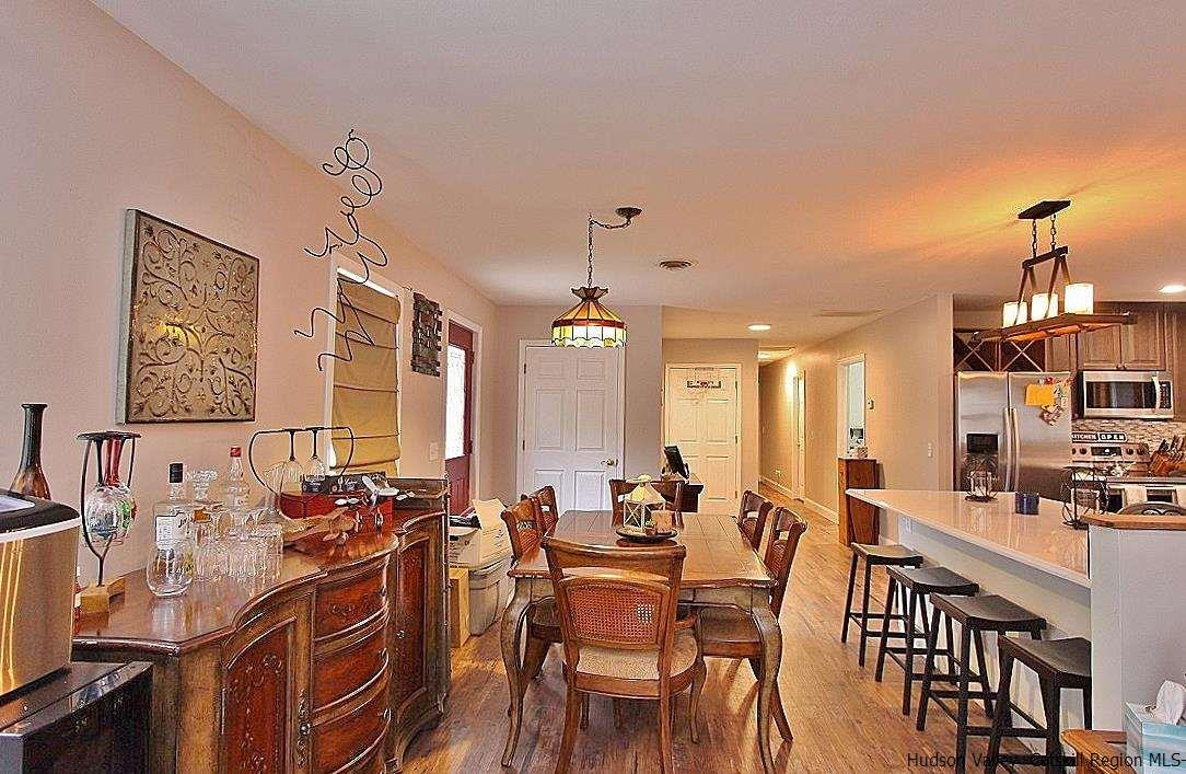 150 Nelson Hoff Road Saugerties, NY 12477 - Photo 14 of 31 a view of a a dining room with furniture window and wooden floor