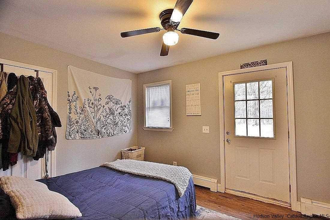 150 Nelson Hoff Road Saugerties, NY 12477 - Photo 16 of 31 a bedroom with a bed and a window