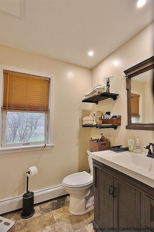 150 Nelson Hoff Road Saugerties, NY 12477 - Photo 22 of 31 a bathroom with a sink a toilet and mirror