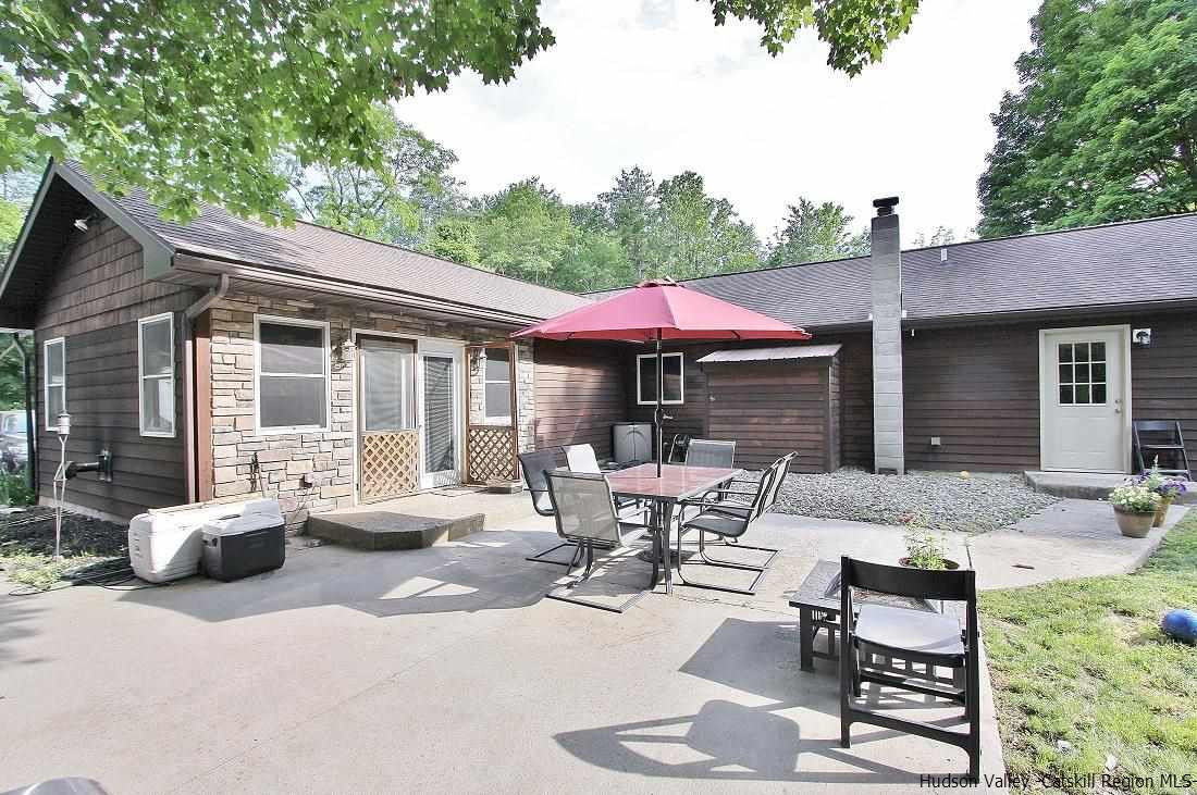 150 Nelson Hoff Road Saugerties, NY 12477 - Photo 26 of 31 a view of a house with backyard sitting area and garden