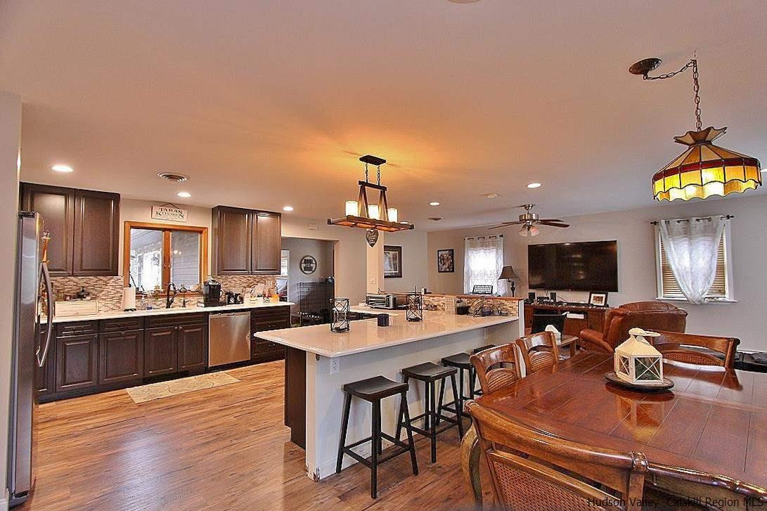 150 Nelson Hoff Road Saugerties, NY 12477 - Photo 7 of 31 a large kitchen with a table and chairs