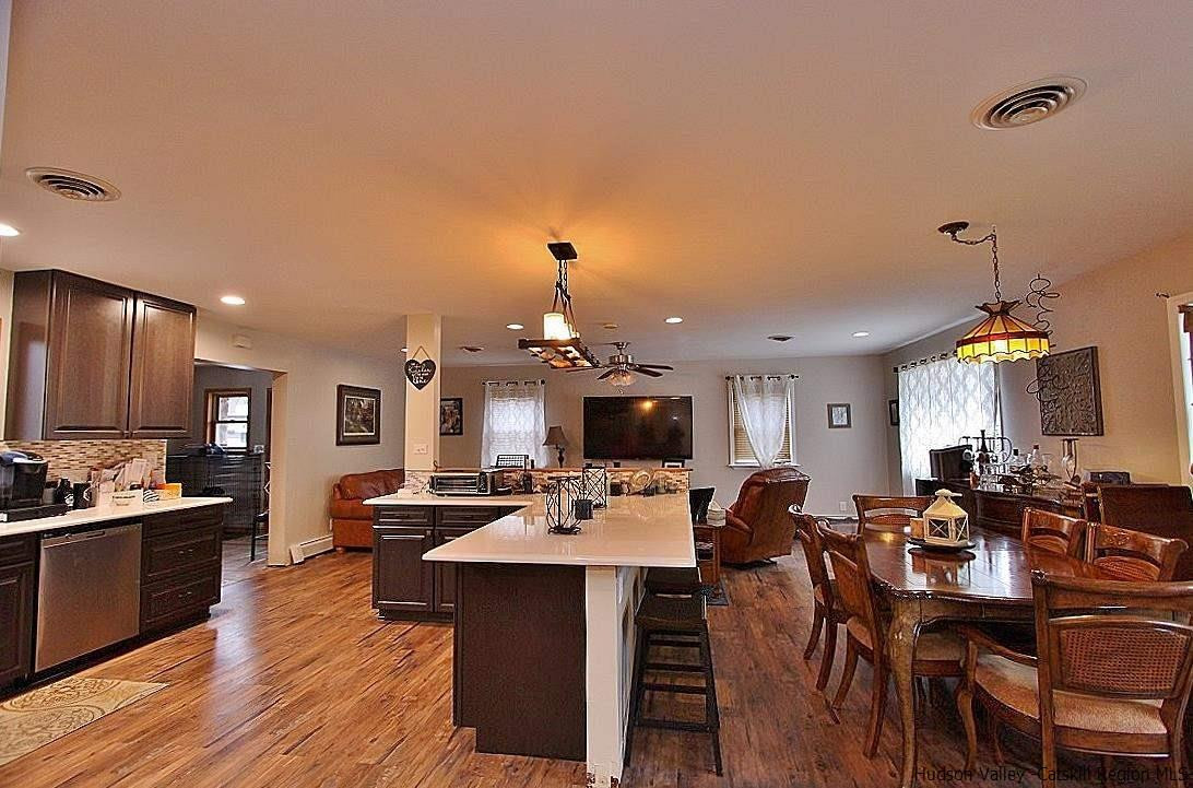 150 Nelson Hoff Road Saugerties, NY 12477 - Photo 8 of 31 a view of a dining room with furniture and wooden floor