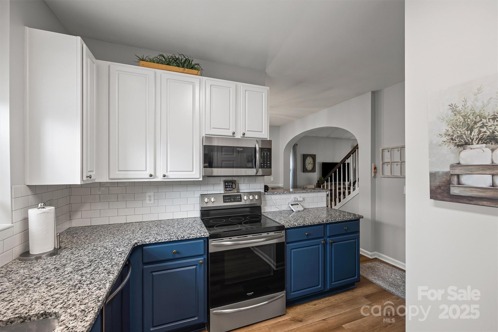 316 Tinder Box Lane Fort Mill, SC 29708 - Photo 11 of 28 a kitchen with stainless steel appliances granite countertop a sink stove and cabinets