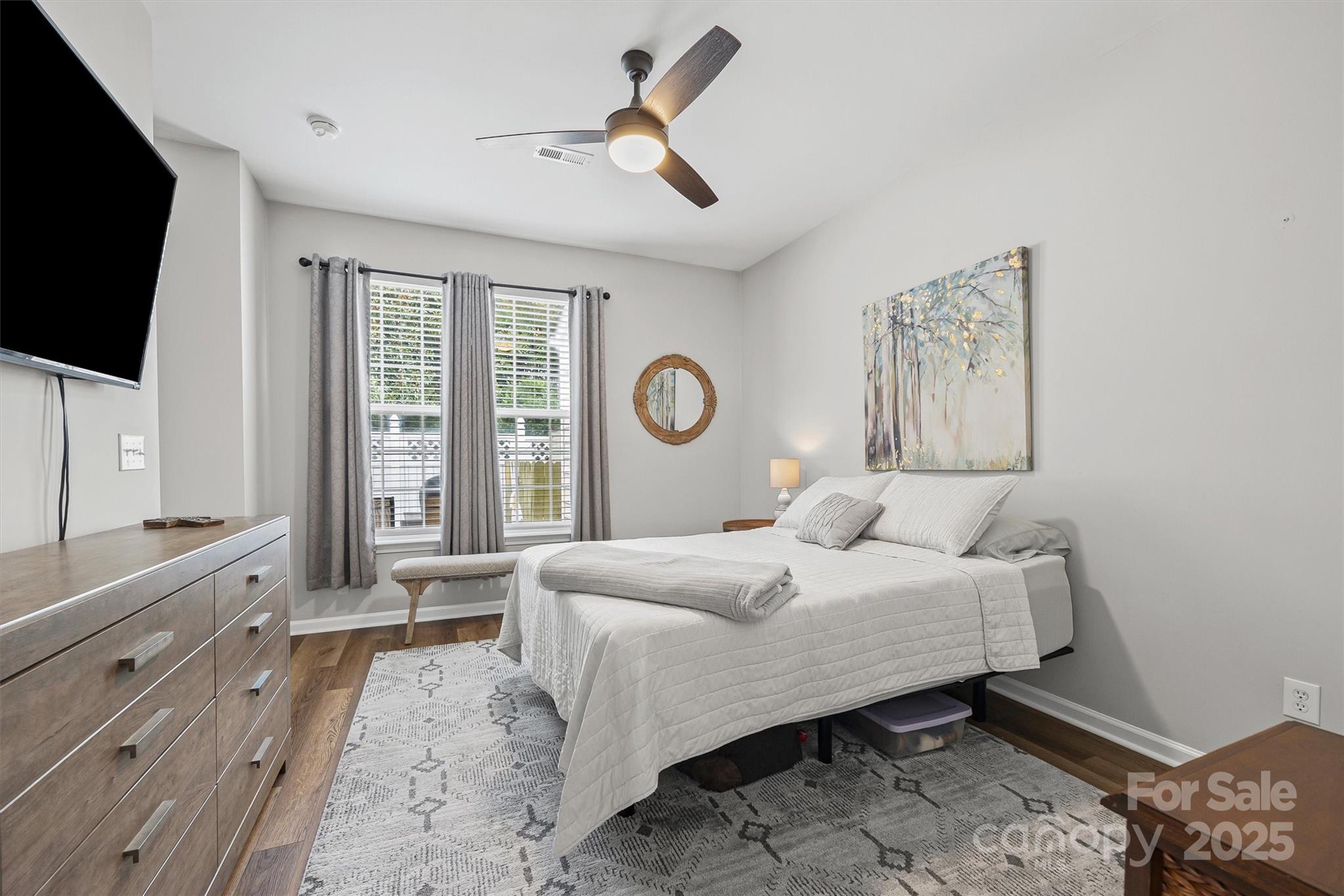 316 Tinder Box Lane Fort Mill, SC 29708 - Photo 14 of 28 a bedroom with a large bed and a flat tv screen on dresser