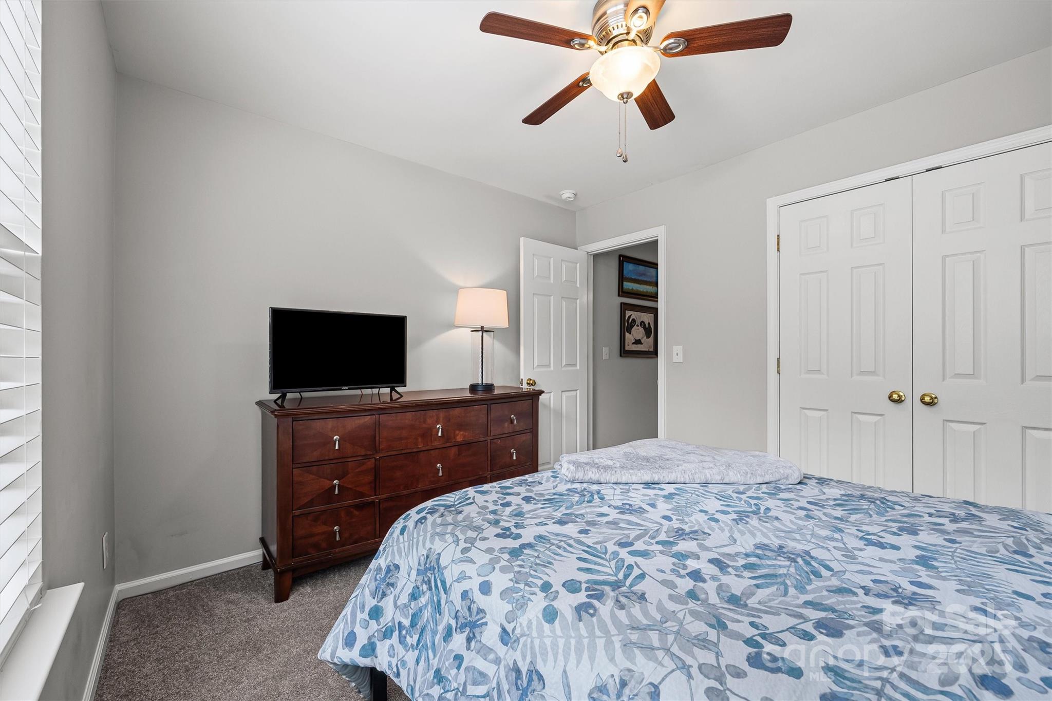 316 Tinder Box Lane Fort Mill, SC 29708 - Photo 19 of 28 a bedroom with a bed and a flat screen tv