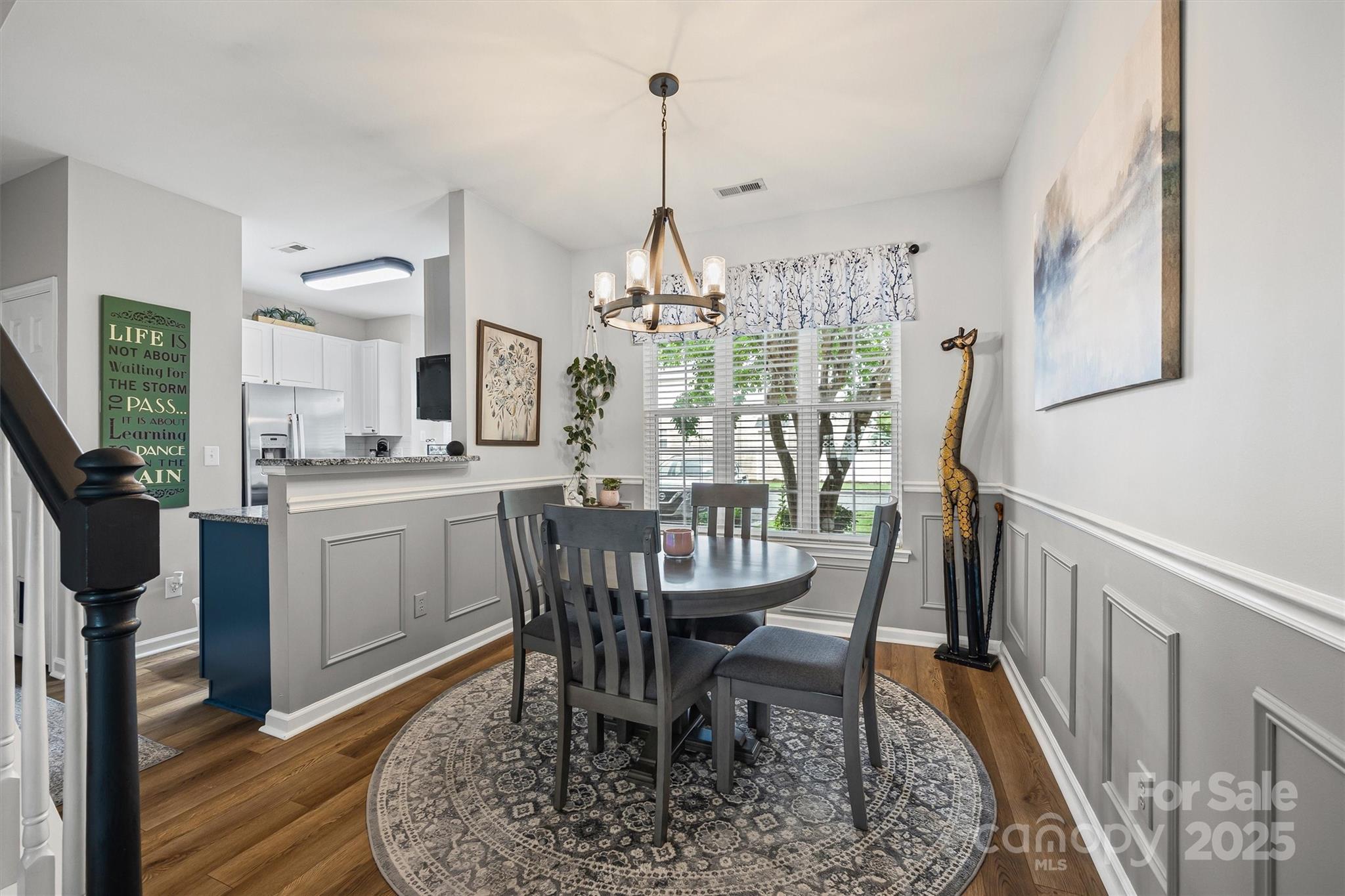 316 Tinder Box Lane Fort Mill, SC 29708 - Photo 7 of 28 a dining room with furniture a chandelier and wooden floor