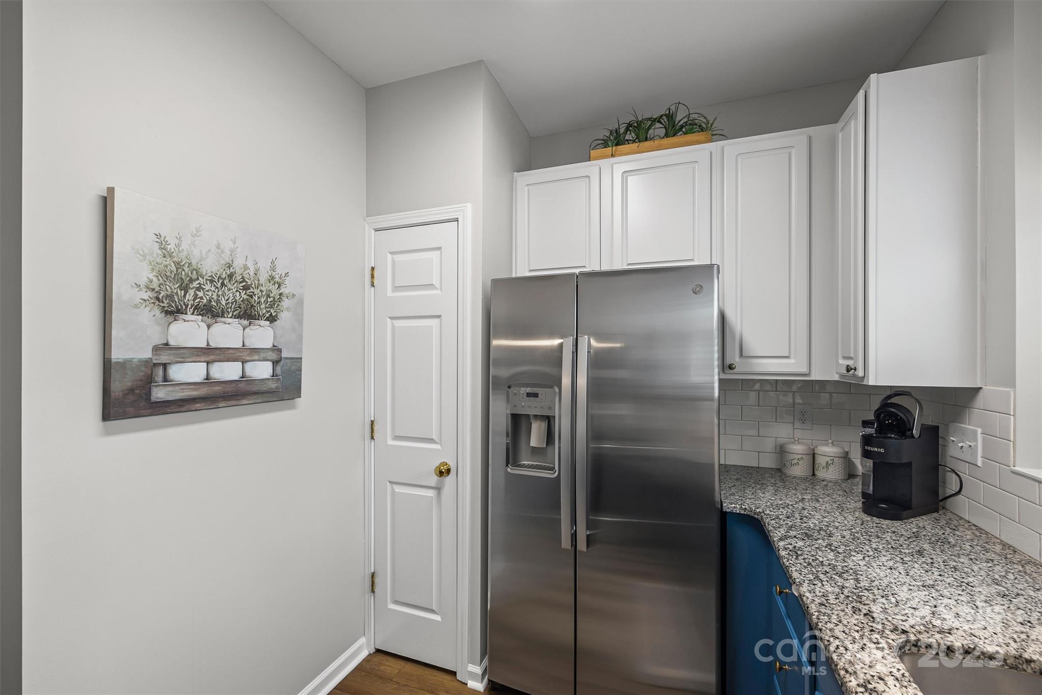 316 Tinder Box Lane Fort Mill, SC 29708 - Photo 10 of 28 a kitchen with a refrigerator and cabinets