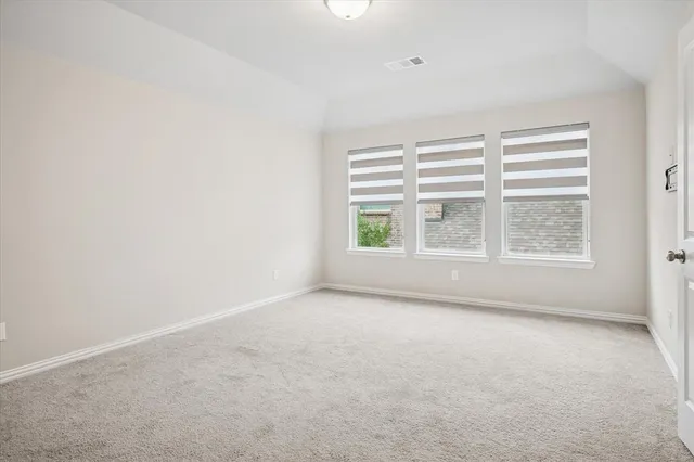 a bathroom with a shower sink and mirror