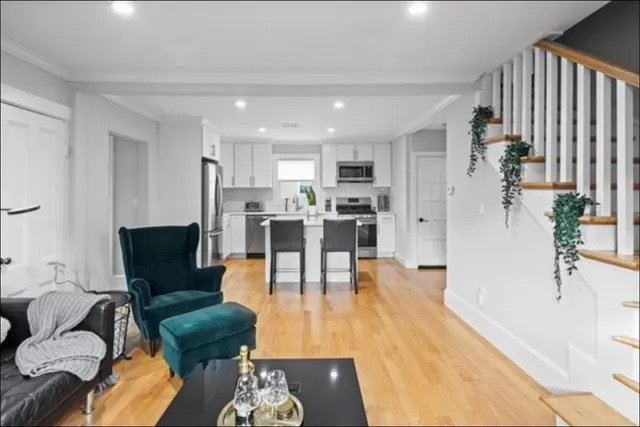 a living room with furniture and a table