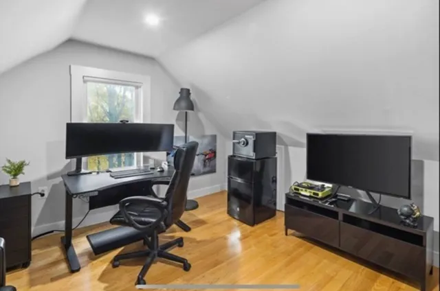 a workspace with furniture and a flat screen tv