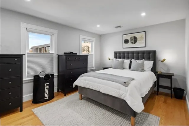 a bedroom with a bed and a dresser