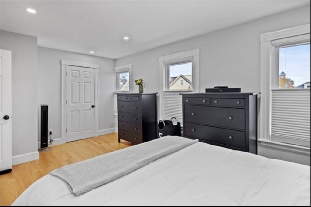 14 Everett Street, Unit 2 Medford, MA 02155 - Photo 20 of 24 a bedroom with a bed and a dresser