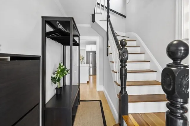 a view of entryway with wooden floor