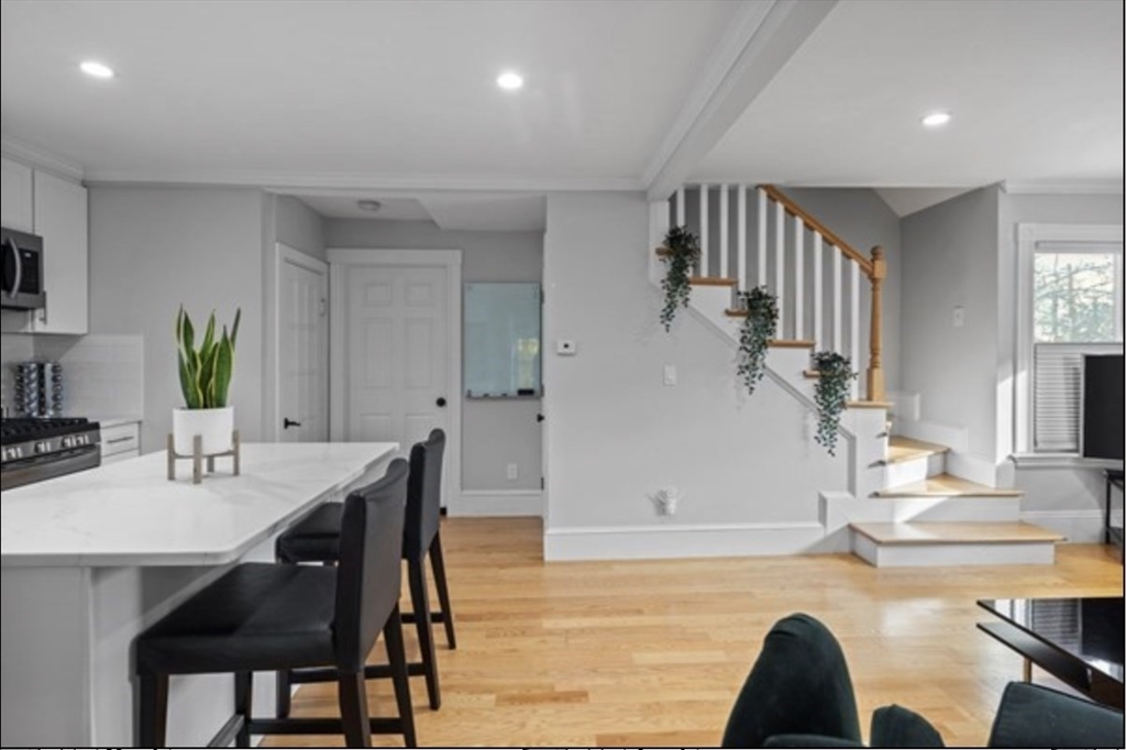 14 Everett Street, Unit 2 Medford, MA 02155 - Photo 7 of 24 a living room with dining room and couches