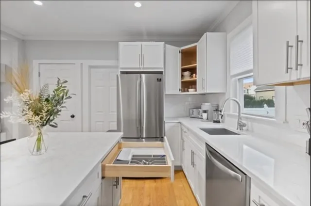 a kitchen with a sink stove and refrigerator