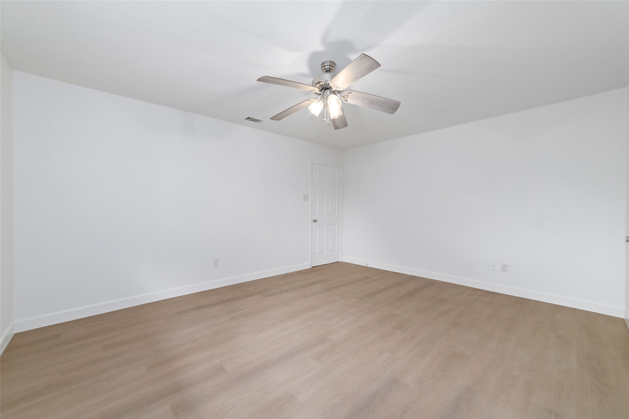 5023 Monteith Drive Spring, TX 77373 - Photo 14 of 20 Bright secondary bedroom with a ceiling fan and clean, open layout, creating a flexible space that feels light and inviting.