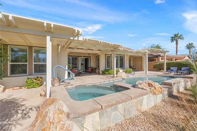 a view of a dining room with furniture and window